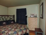 2nd Bedroom on Main Level with Queen Sized Bed with Dresser